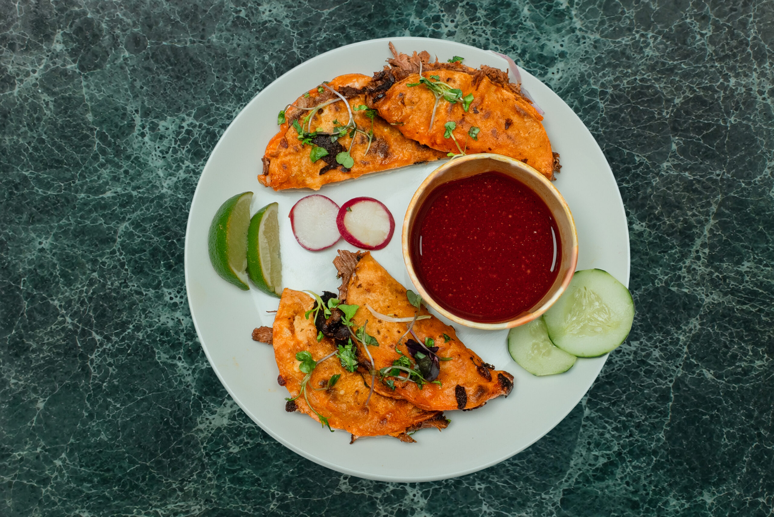 Birria tacos with consomme