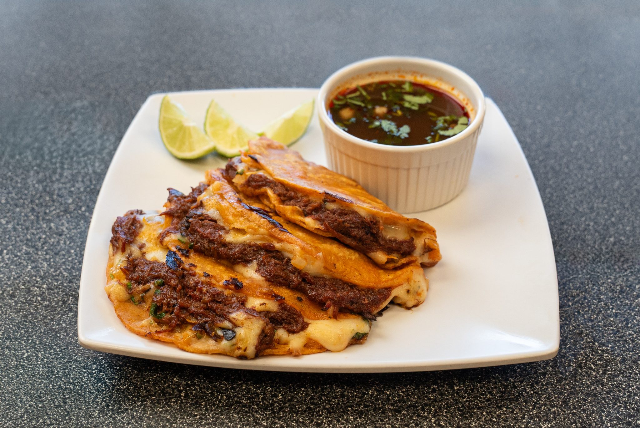 Restaurant photography packages: quesabirria and consommé photographed for a Denver taqueria menu