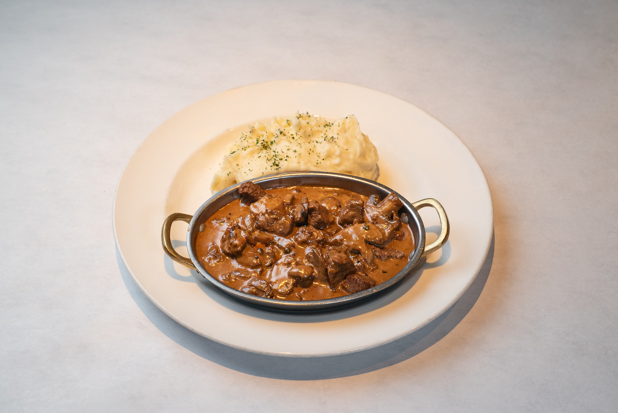 Beef tenderloin tips with mushrooms and mashed potatoes — Denver restaurant food photography